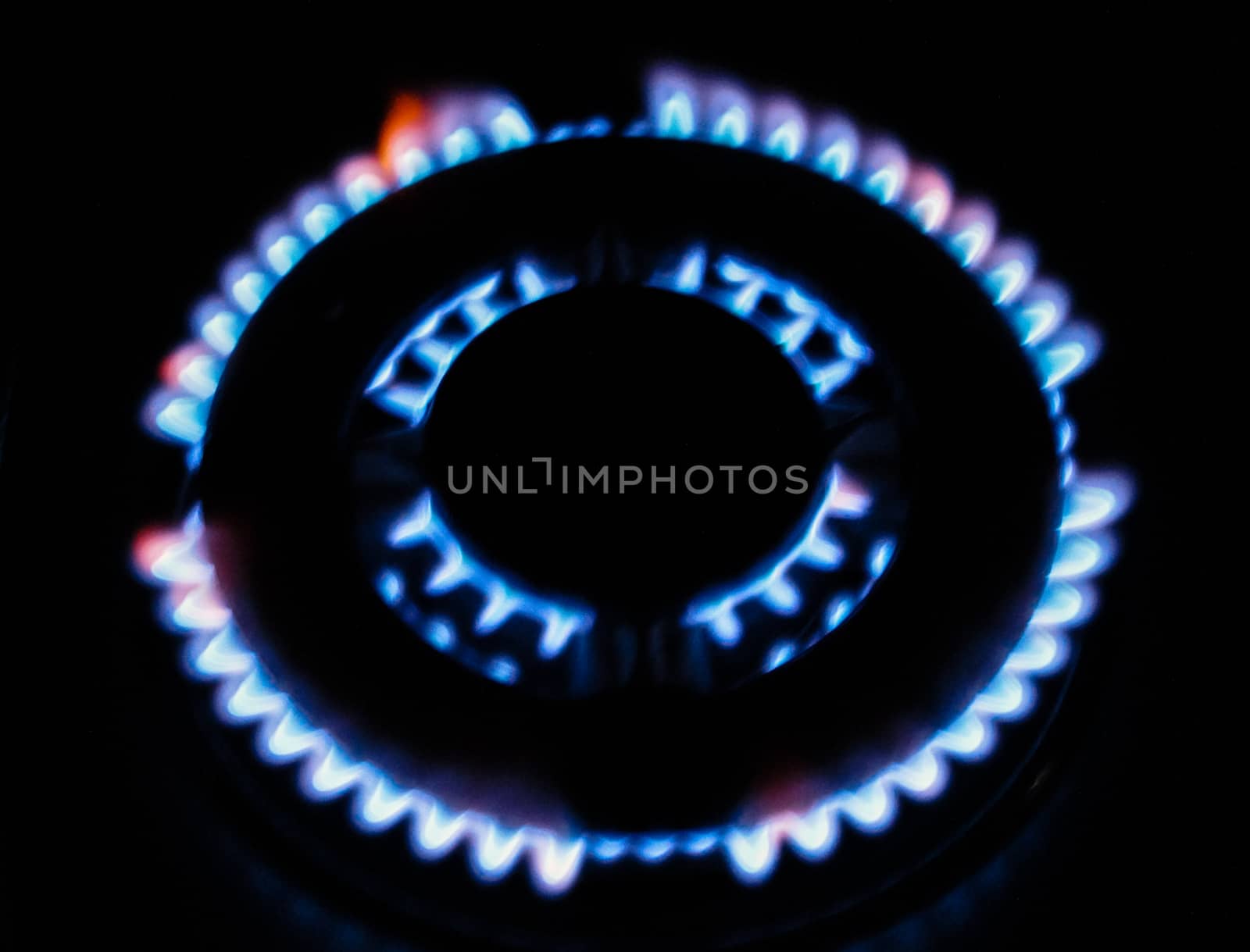 the fire of the gas stove over black background by Oleczka11