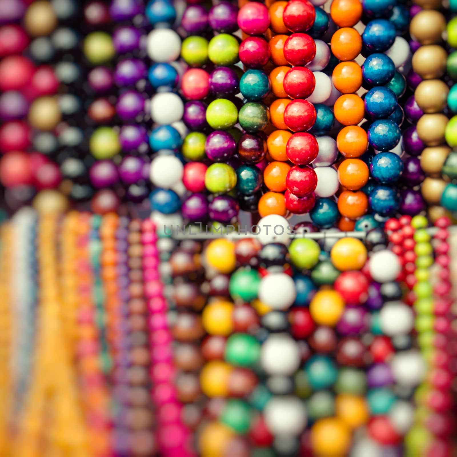 Wooden colored beads on display on the market in Zakopane, Poland 