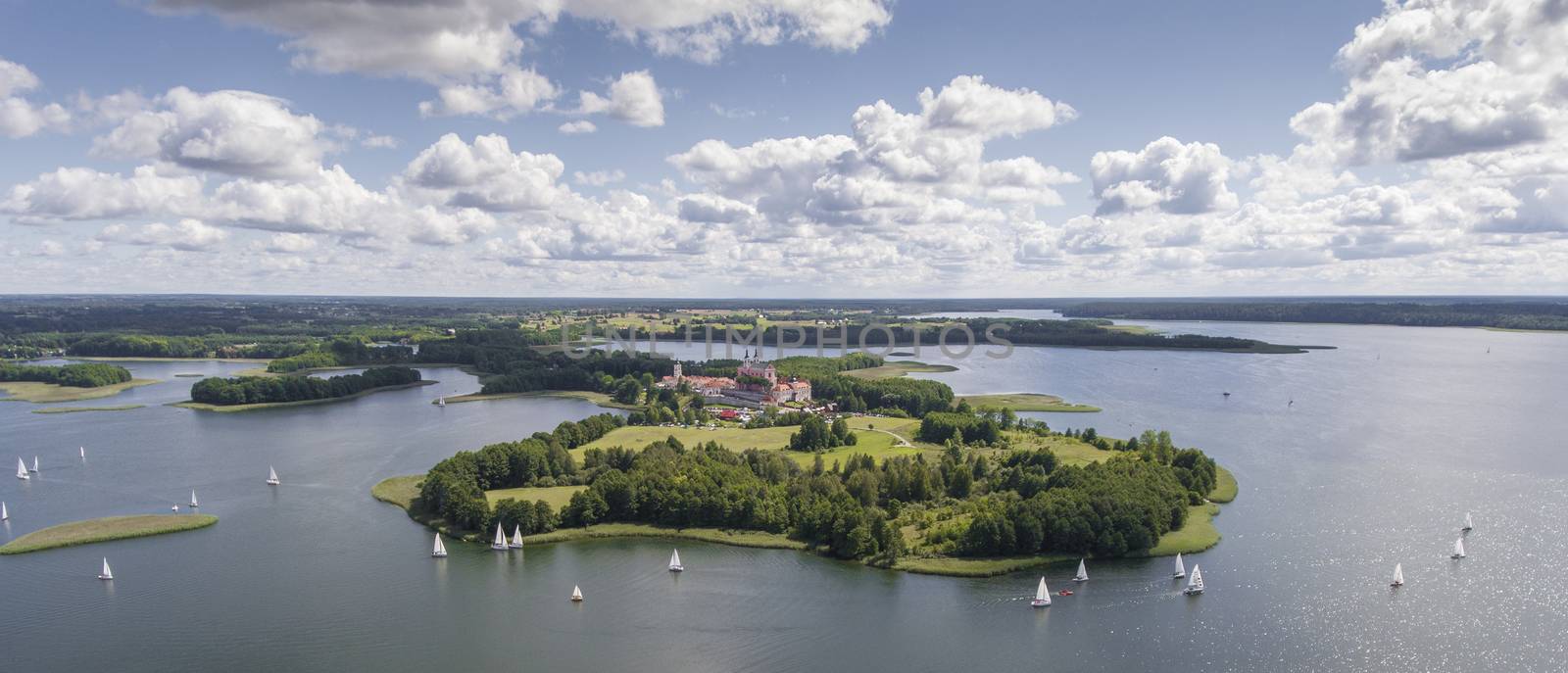 Lake Wigry National Park. Suwalszczyzna, Poland. Blue water and whites clouds. Summer time. View from above.