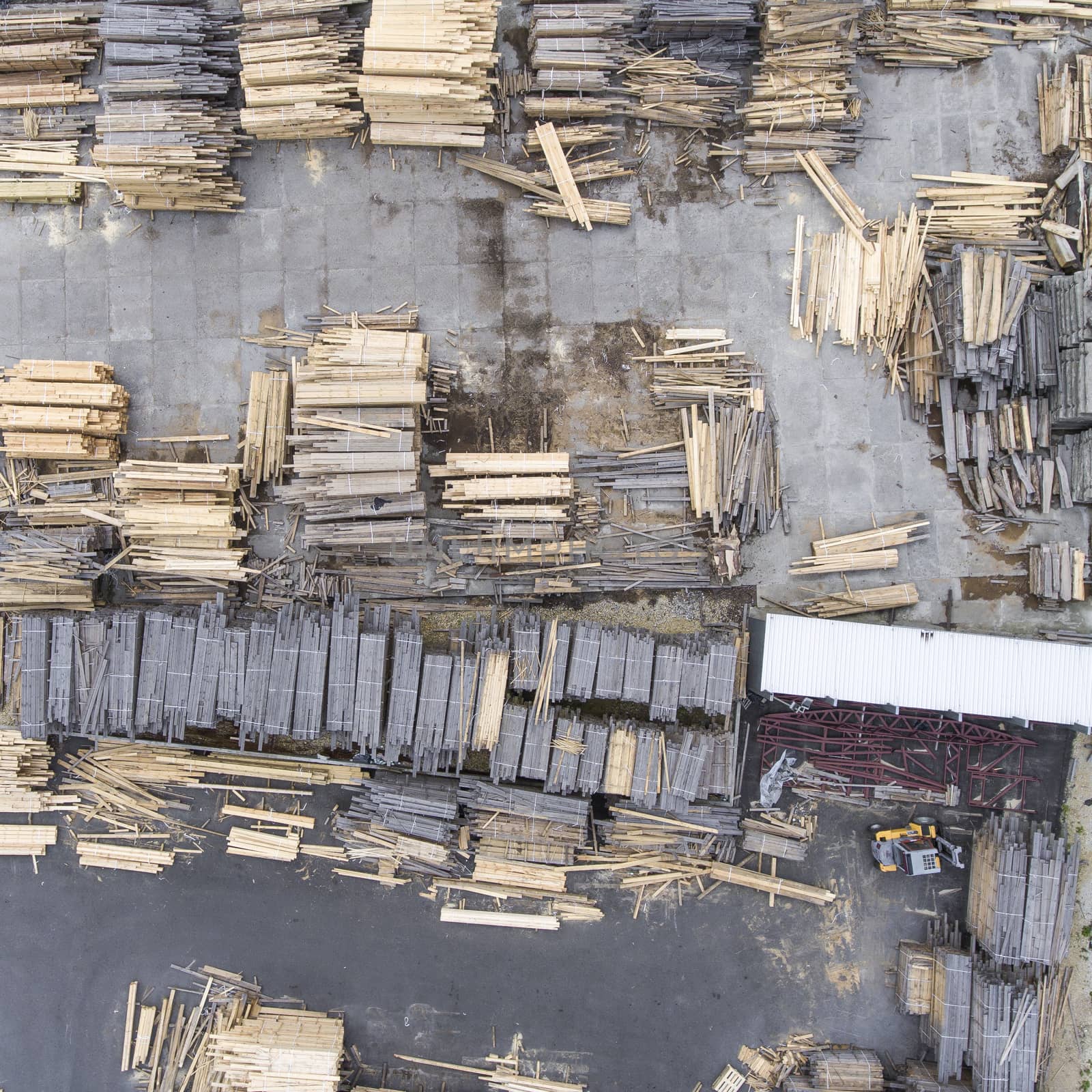 Sawmill. Felled trees, logs stacked in a pile. View from above.  by mariusz_prusaczyk