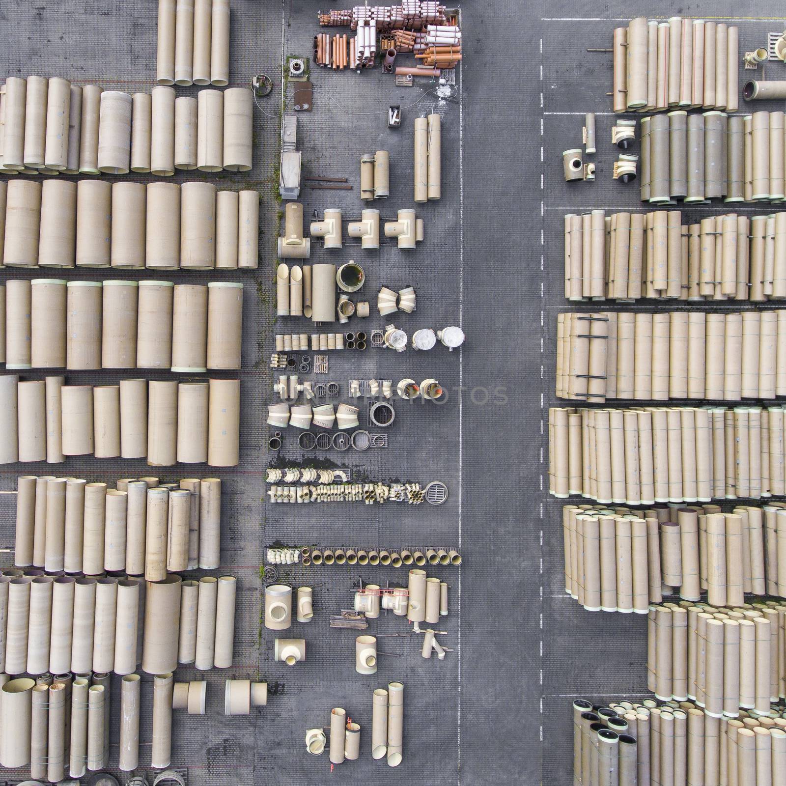 Industrial concrete drainage pipes stacked for construction. New by mariusz_prusaczyk