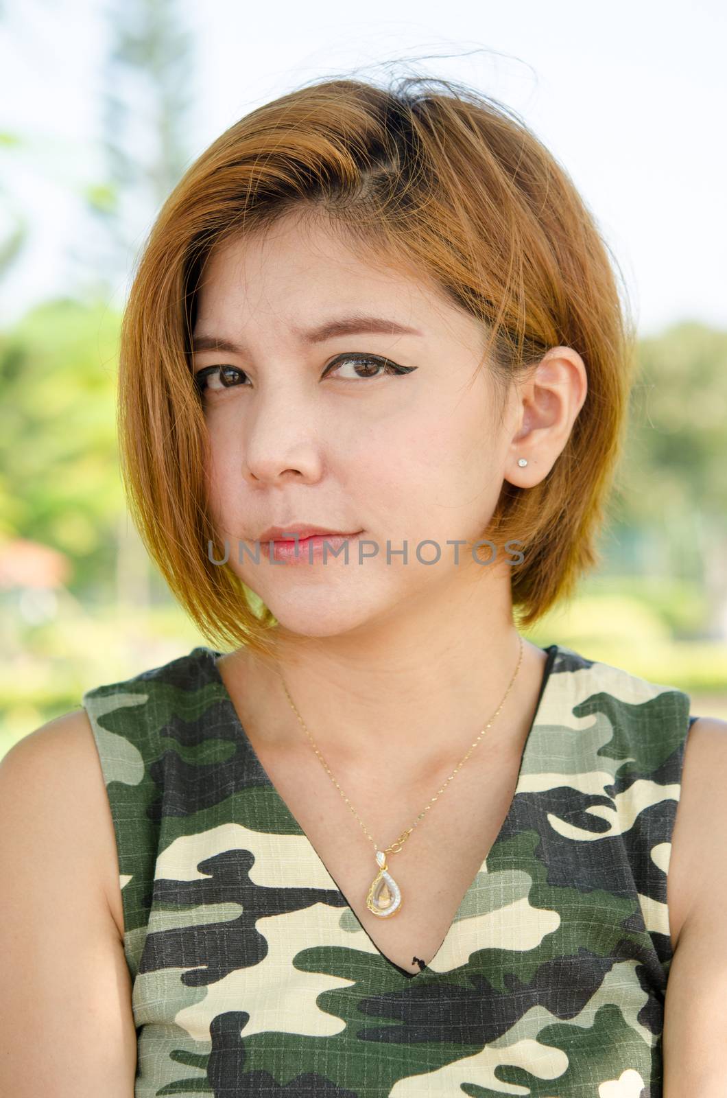 portrait of little girl outdoors in summer