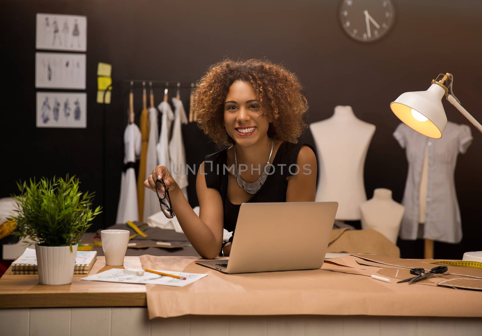 Two young entrepreneur women, and fashion designer working on her atelier