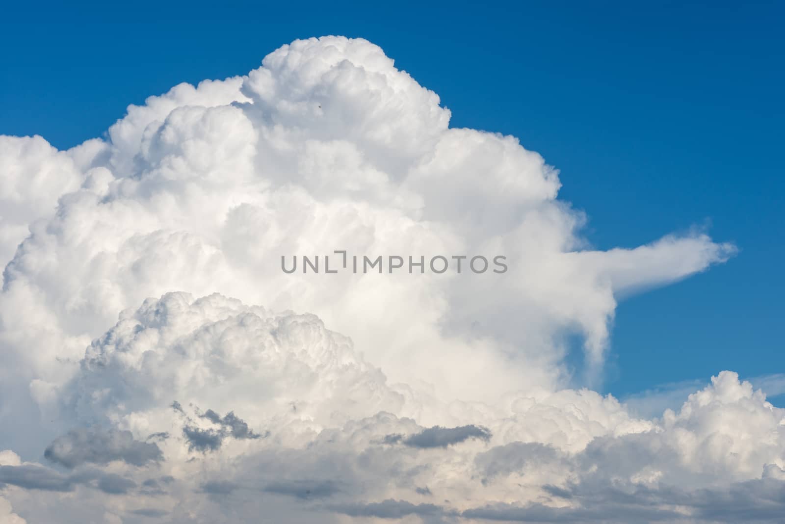 Cumulus clouds forming on blue summer day