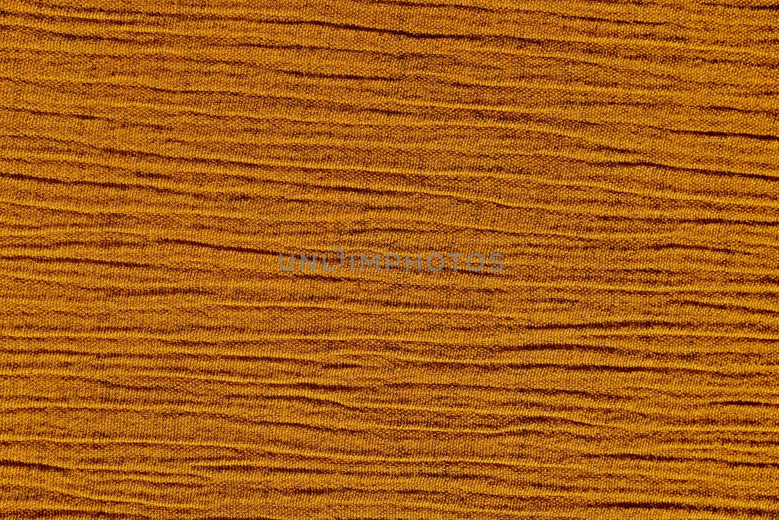 Gold ochre crinkled material with irregular horizontal lines fabric abstract background texture