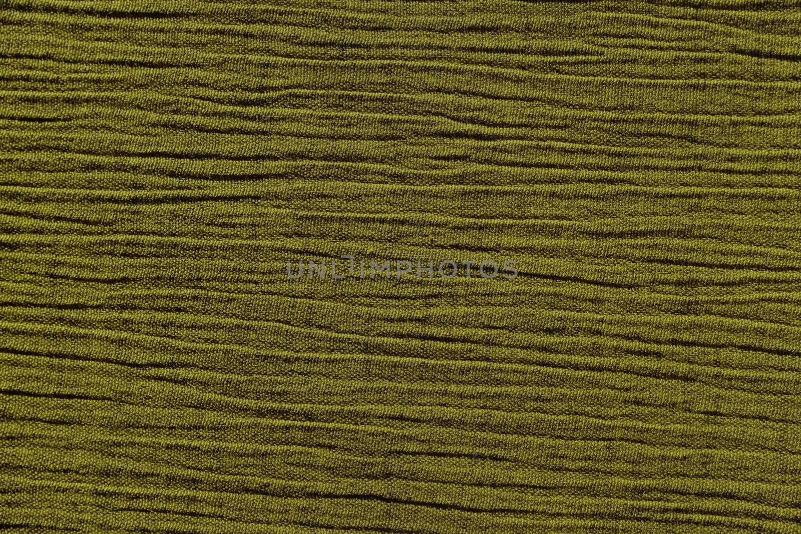 Olive green crinkled material with irregular horizontal lines fabric abstract background texture