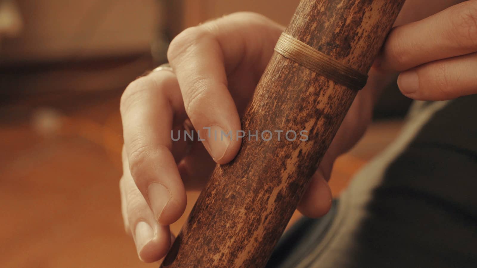 Hands of musician plays the flute by Chudakov