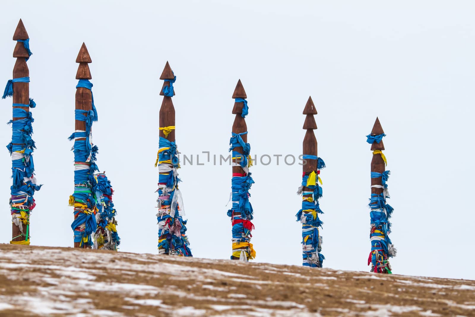 Ribbons on the tree. Winter in mountains