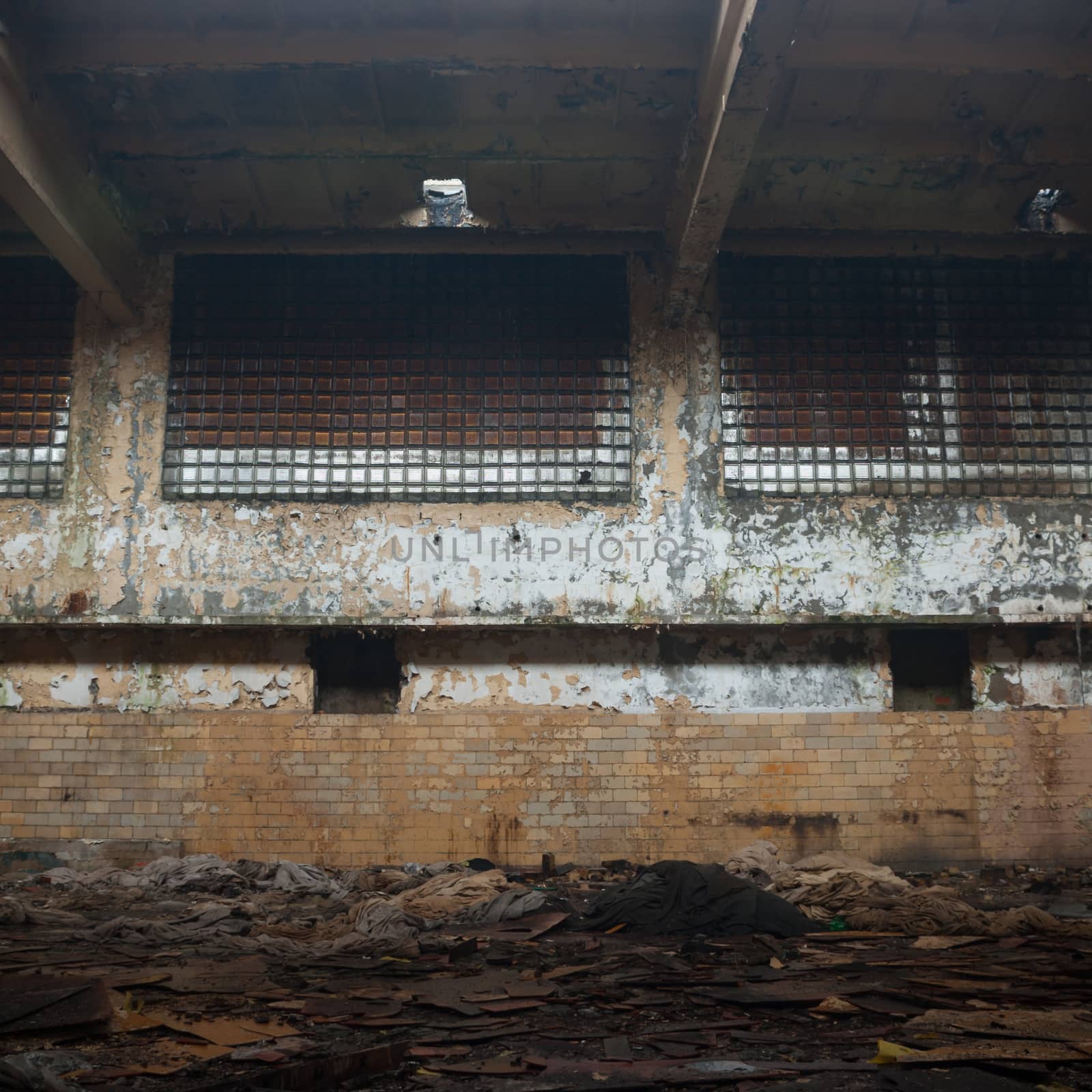 discarded ruin with old windows and wall, industrial window in concrete wall