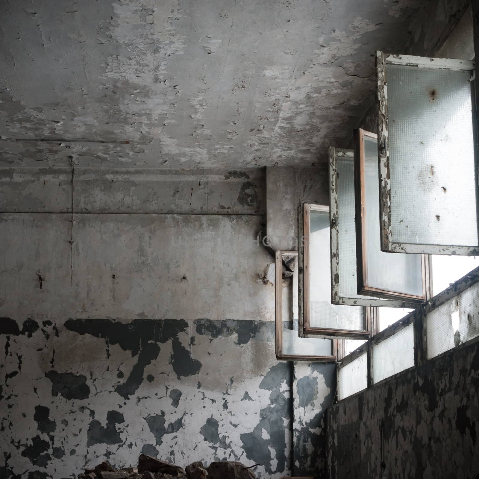 discarded ruin with old windows and wall, industrial window in concrete wall