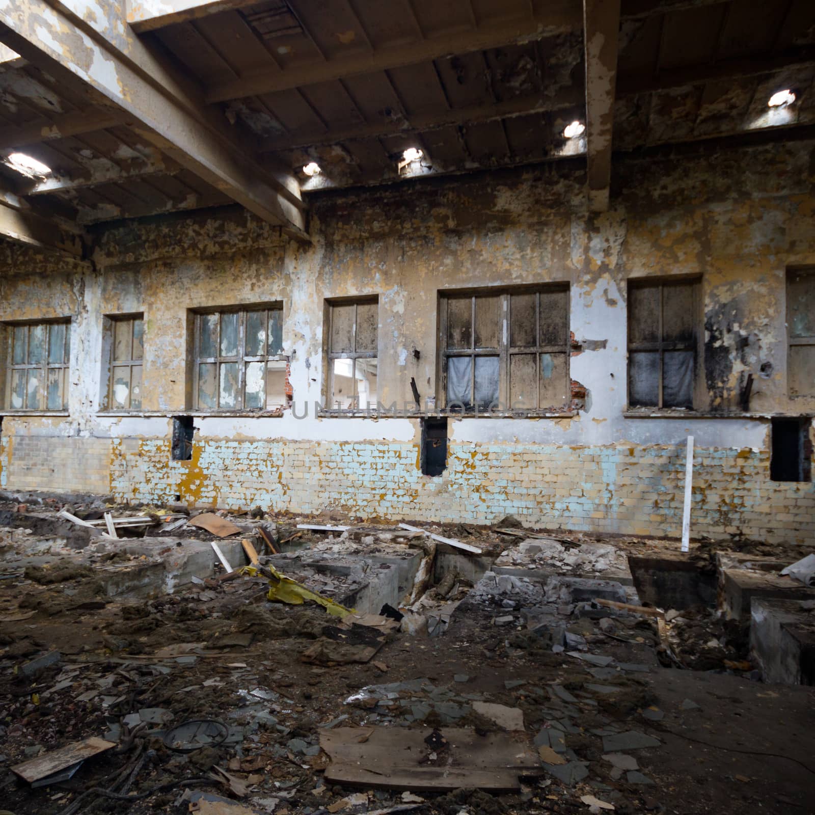 discarded ruin with old windows and wall, industrial window in concrete wall
