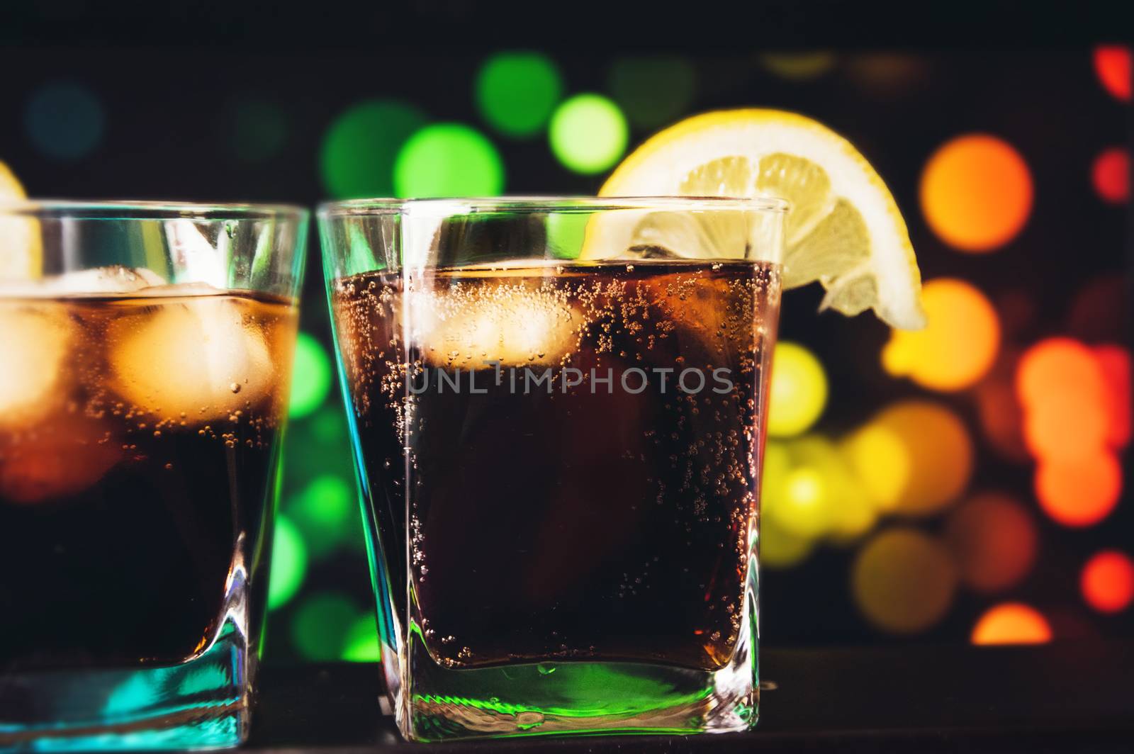 Whiskey Cocktail with Lemon on bright bar background