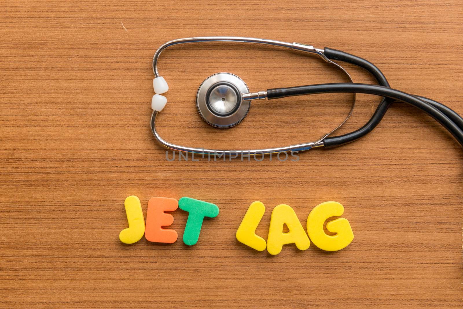 jet lag colorful word with Stethoscope on wooden background