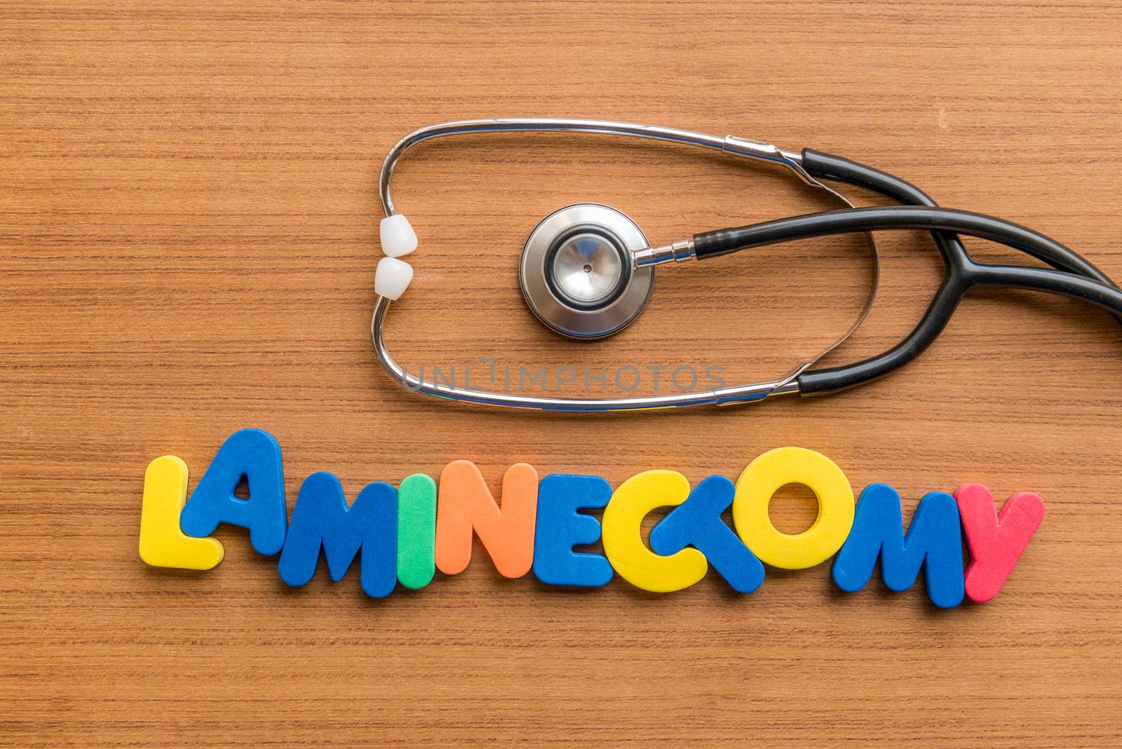 laminectomy colorful word with Stethoscope on wooden background
