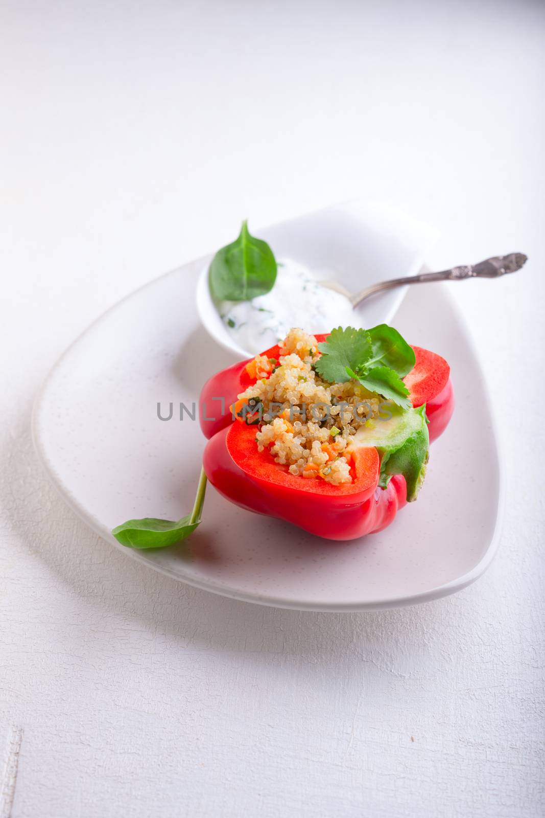 Stuffed red peppers filled with quinoa and vegetables