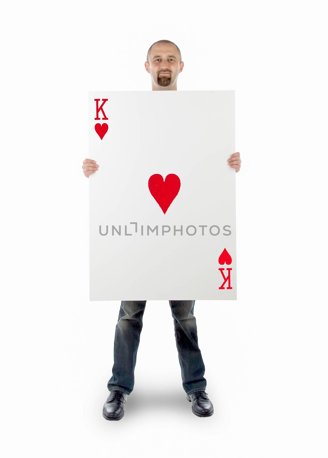 Businessman with large playing card - King of hearts