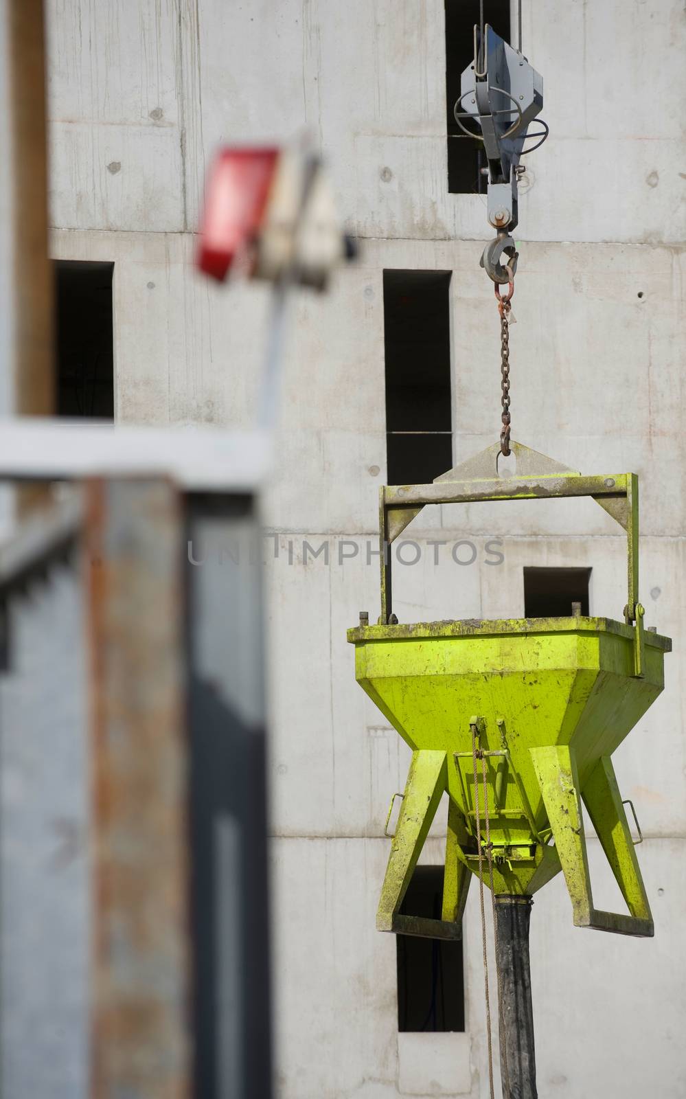 the construction crane and the building against the blue sky, France