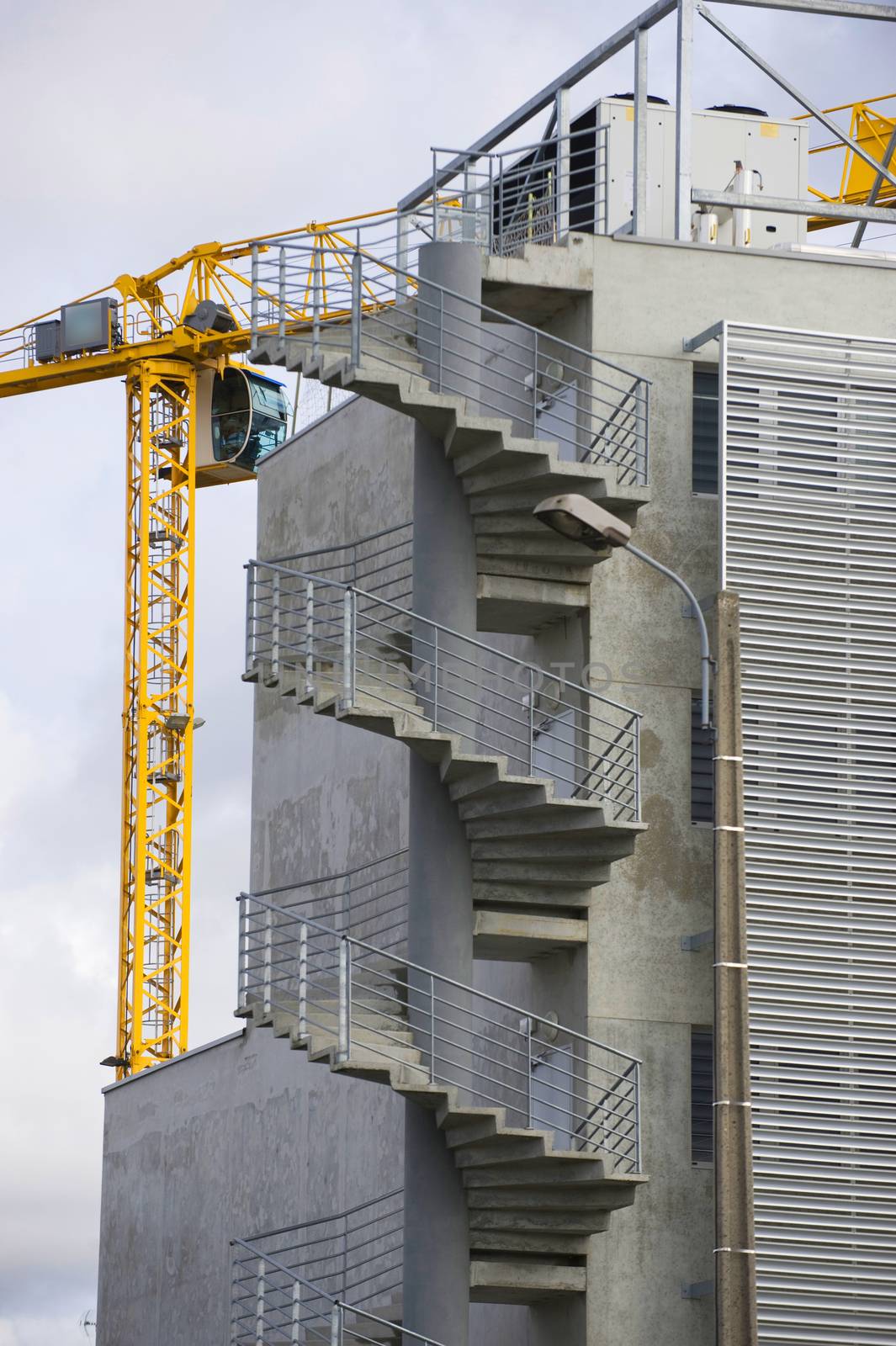 the construction crane and the building against the blue sky, France