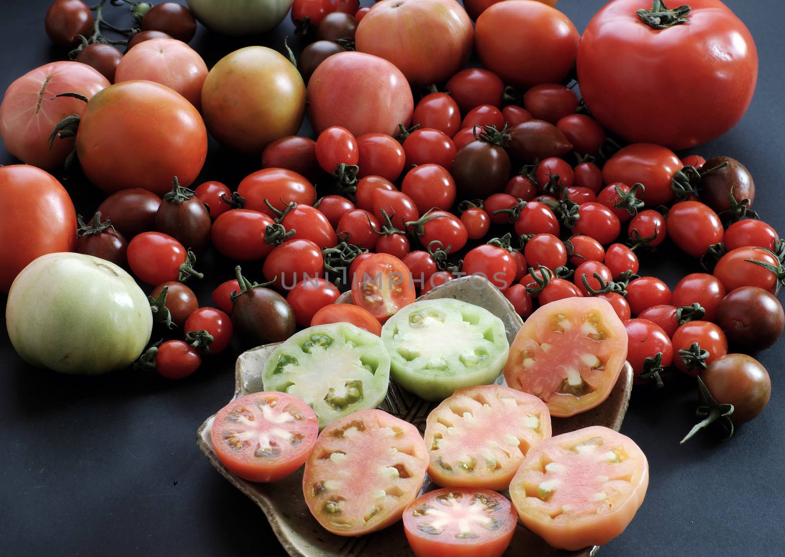 Collect of tomatoes, a popular and cheap food with many uses as antioxidants, skin care, anticancer, good for alzheimer people, this vegetable rich vitamin a, vitamin c, fiber, carotenoids, lycopene