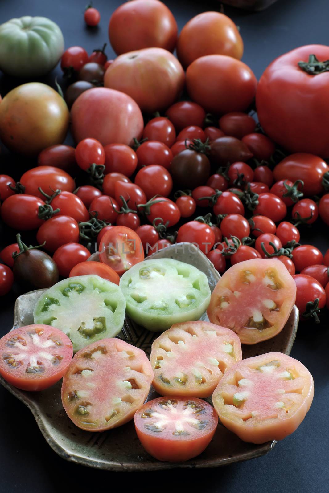 Collect of tomatoes, a popular and cheap food with many uses as antioxidants, skin care, anticancer, good for alzheimer people, this vegetable rich vitamin a, vitamin c, fiber, carotenoids, lycopene