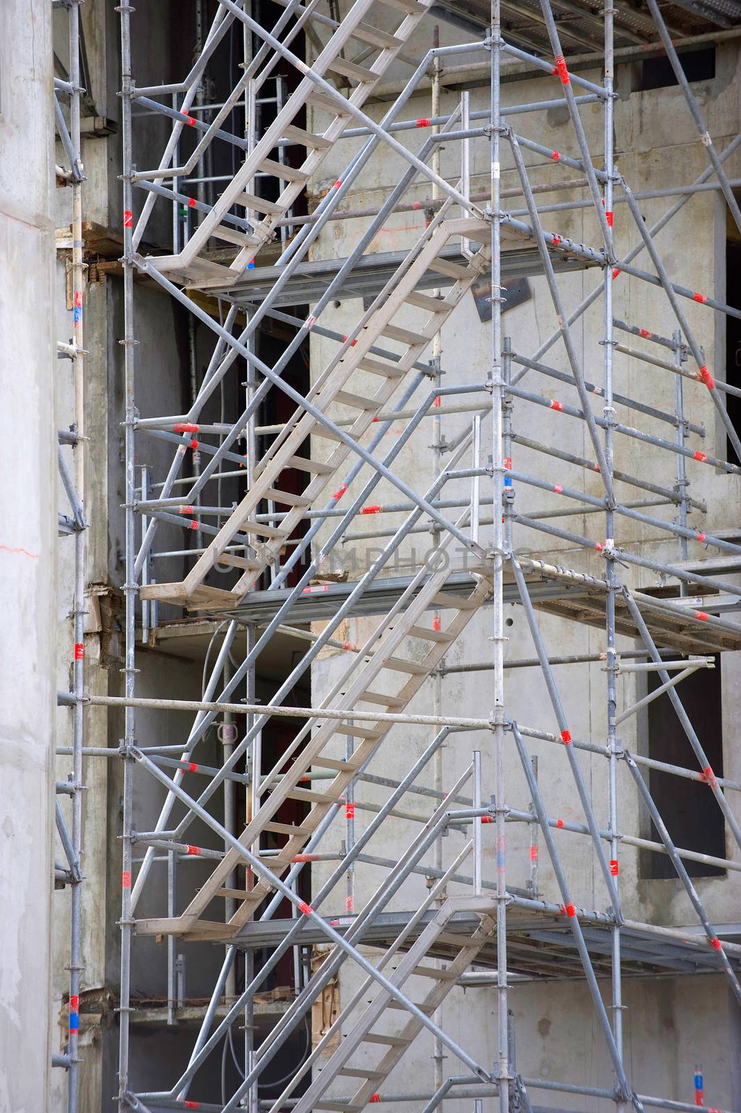 Extensive scaffolding providing platforms, work in progress on new apartment block, France