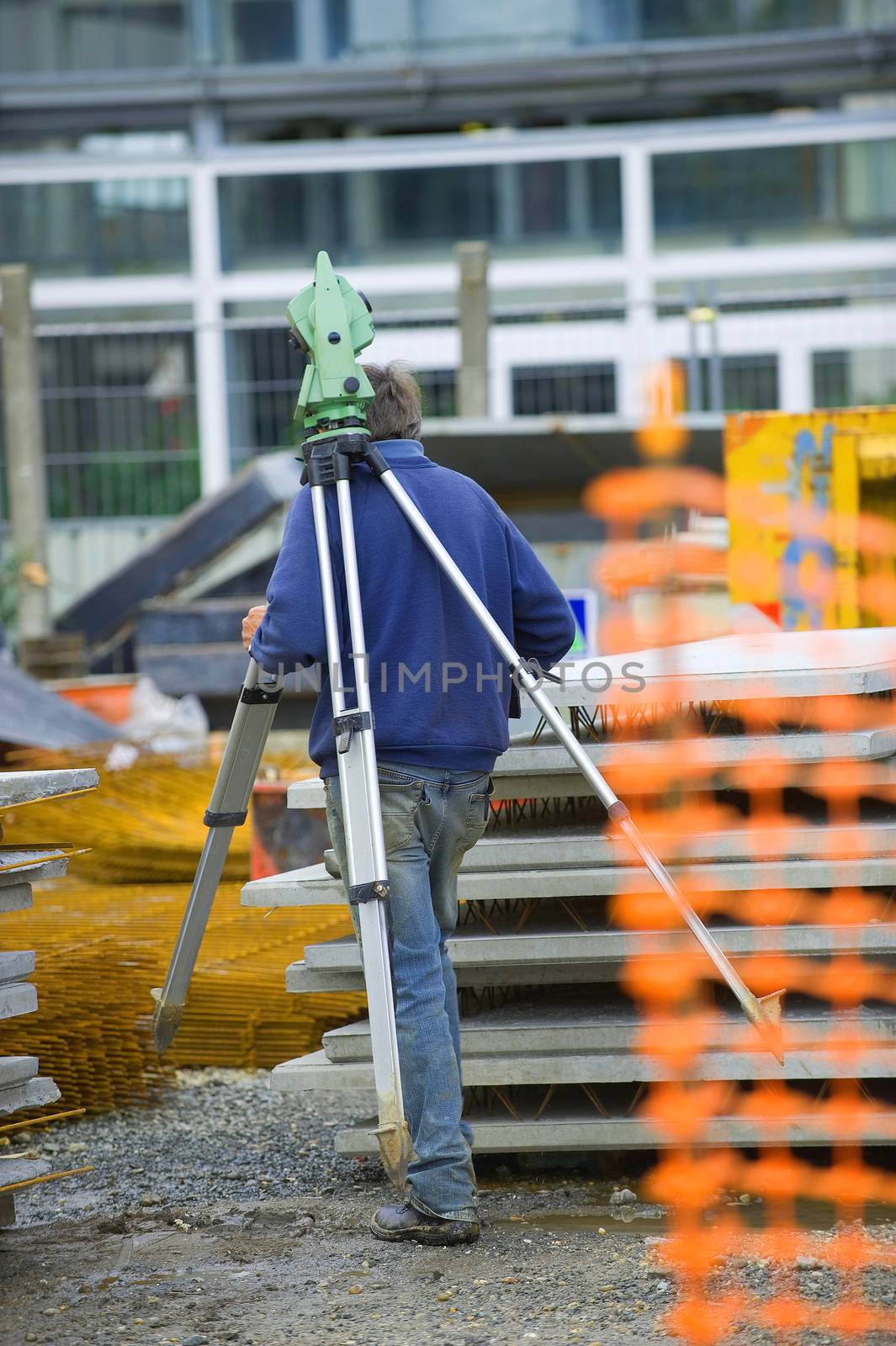 Surveyor equipment theodolite on tripod at building area, France