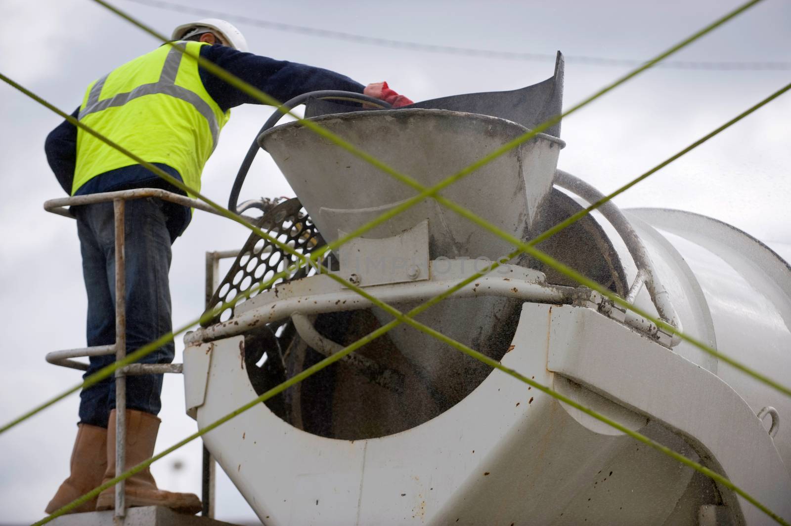Worker and Truck with cement mixer, France