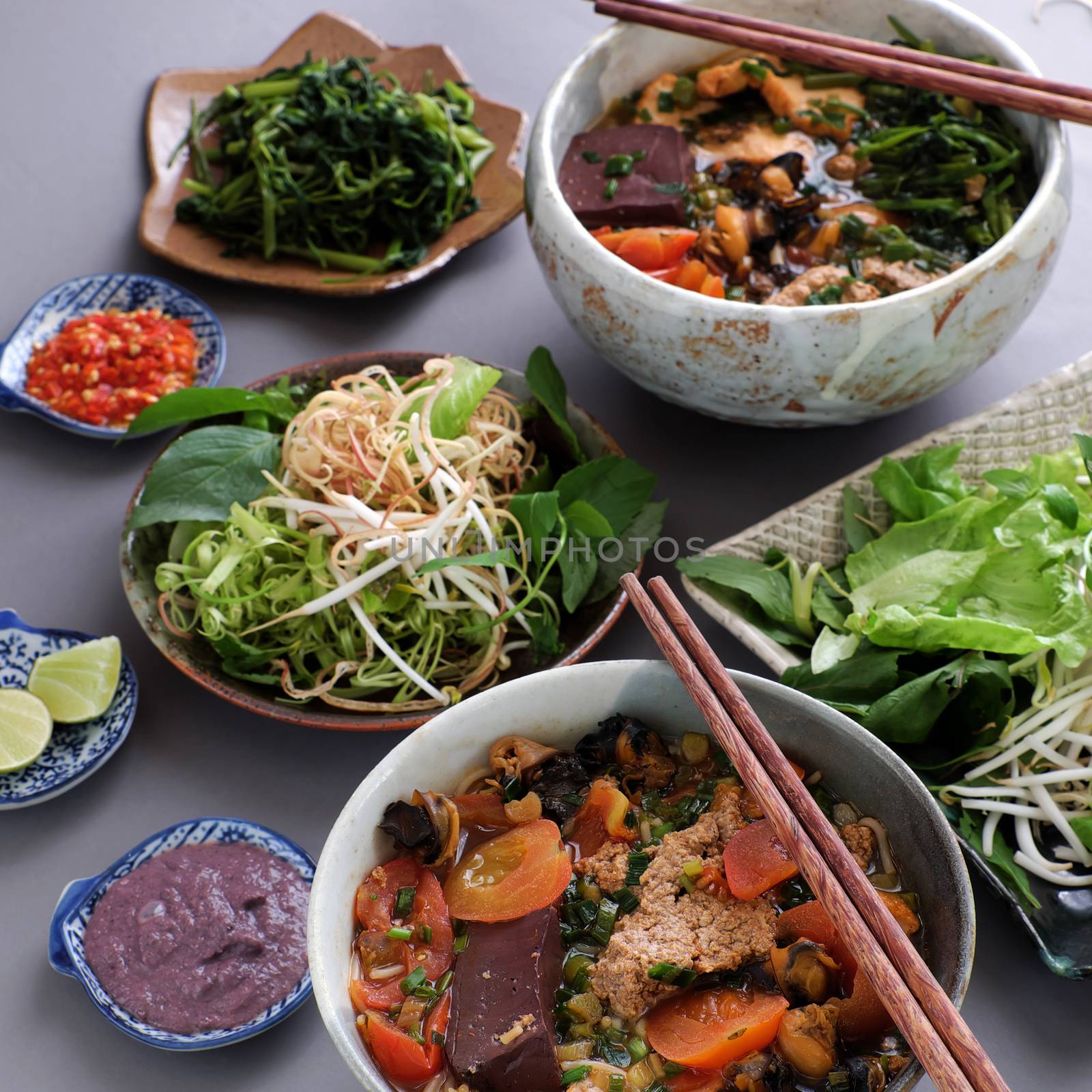 Vietnamese food, bun rieu and canh bun, is popular street food cook from crab, tofu, vermicelli eat with shrimp paste, vegetables, is delicious and cheap dish