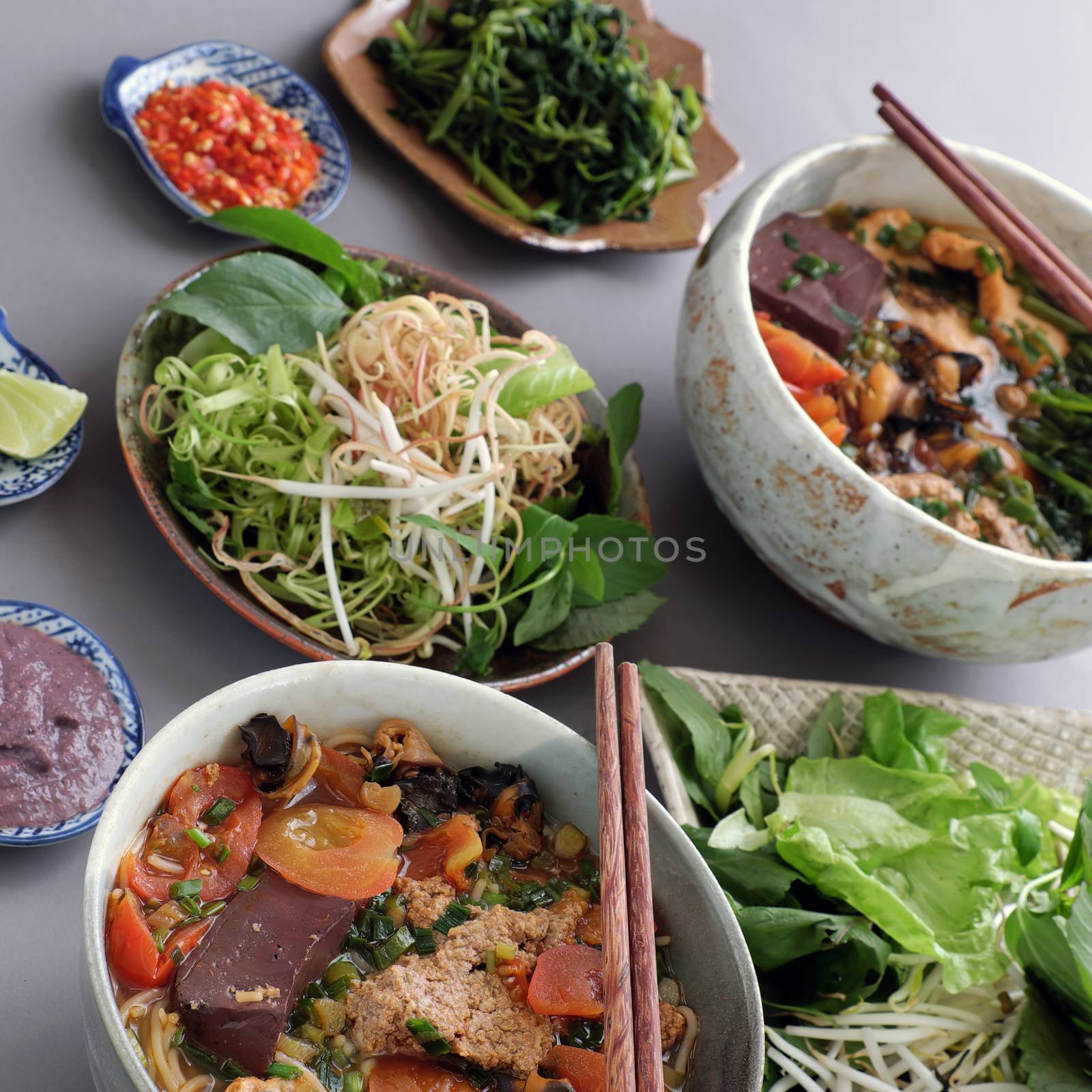 Vietnamese food, bun rieu and canh bun, is popular street food cook from crab, tofu, vermicelli eat with shrimp paste, vegetables, is delicious and cheap dish