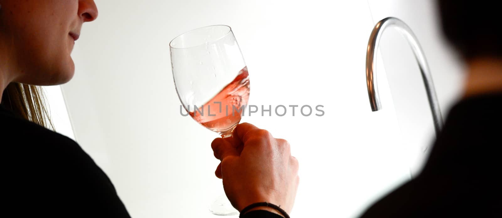 Tasting-White wine pour in a glass, bordeaux wineyard