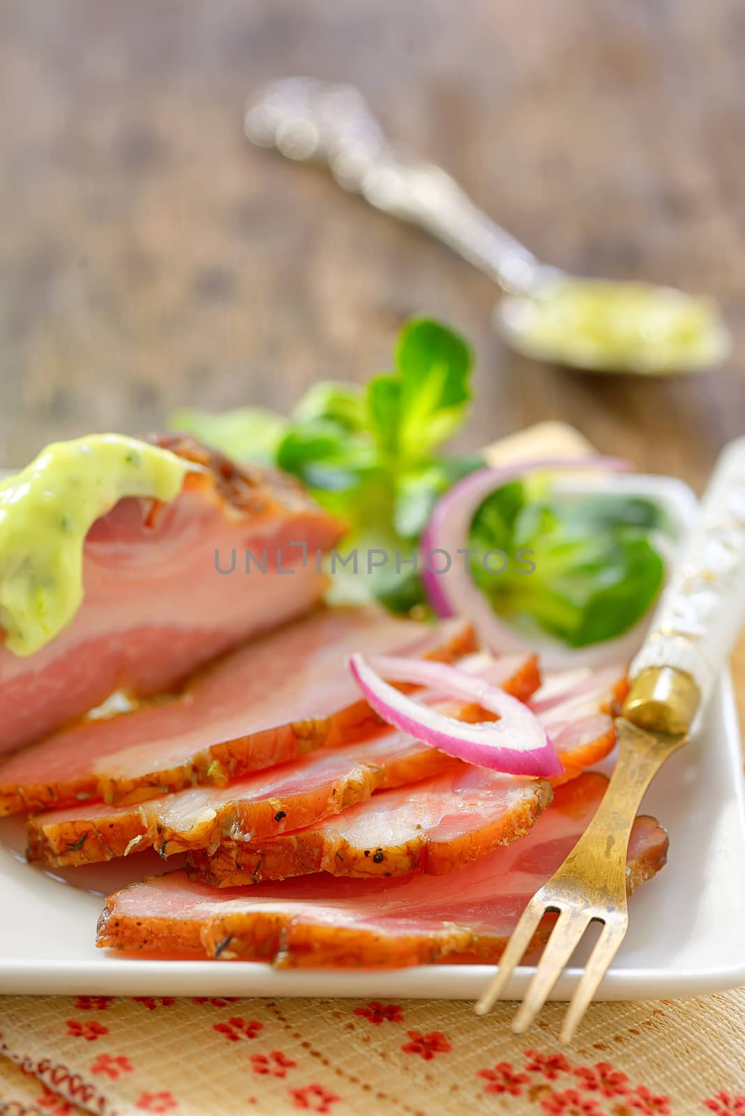 smoked bacon and vegetables on wooden table
