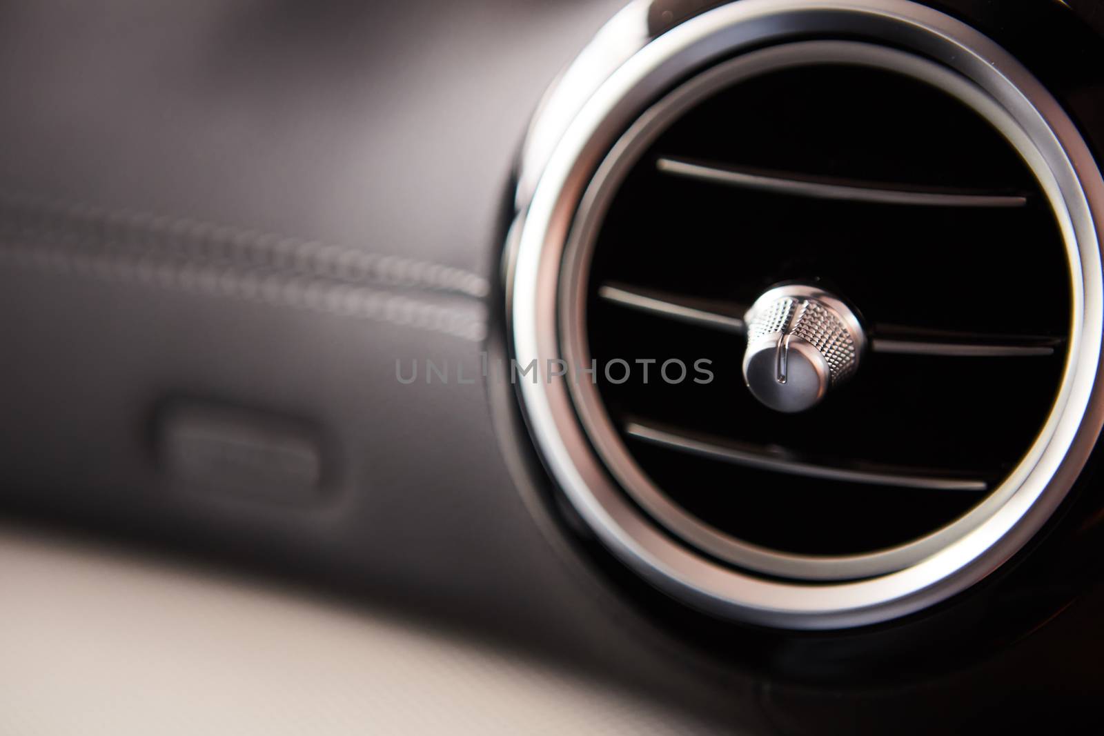 modern car interior, air conditioning hole. Close up