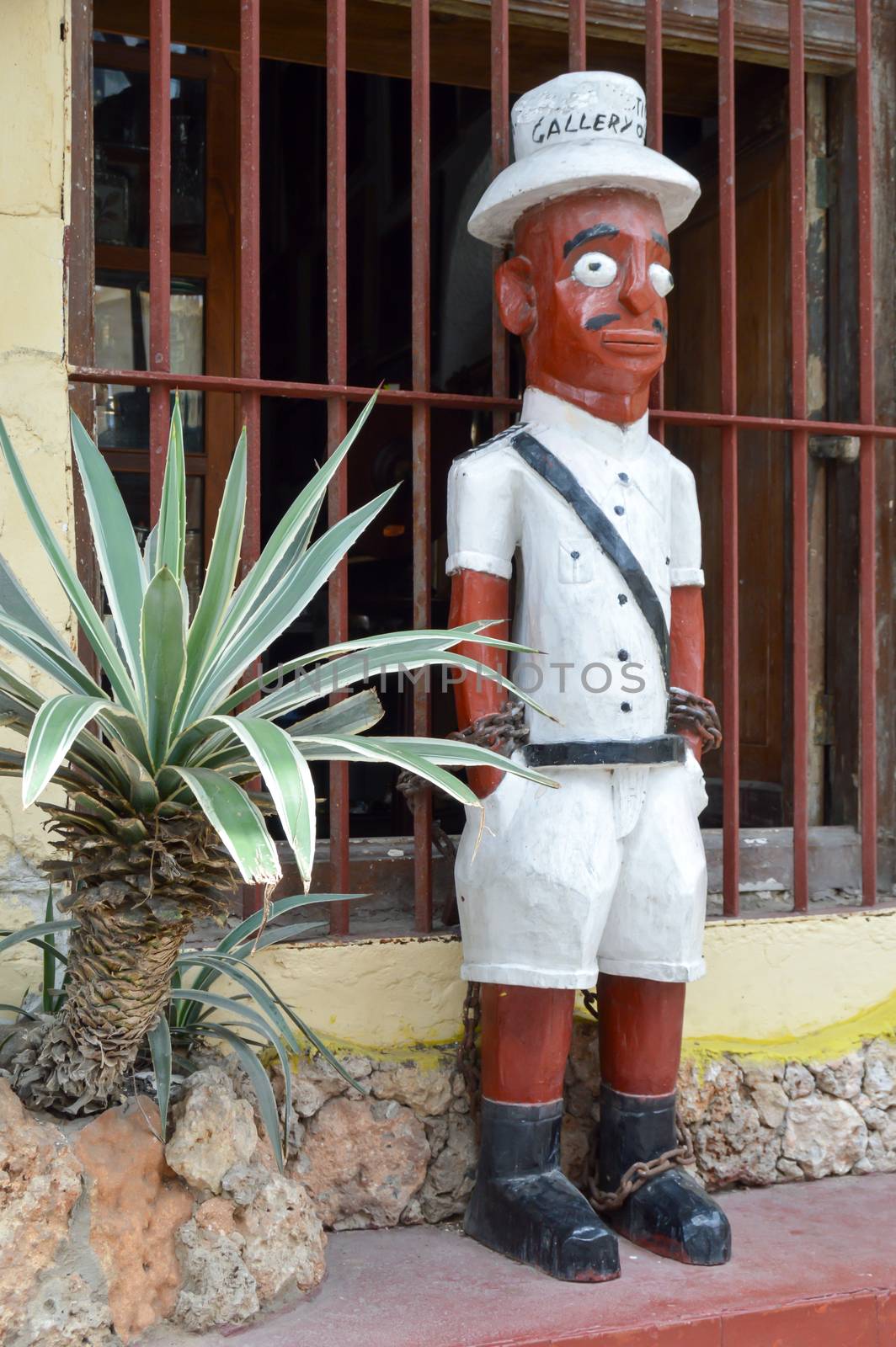 Wooden depiction of an Indian in British colonial costume in the Muslim part of the city of Mombasa in Kenya