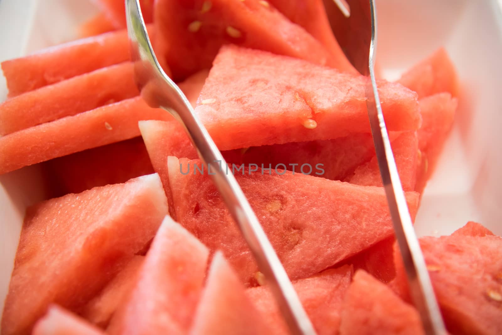 Watermelon slices on a plate . by LarisaP