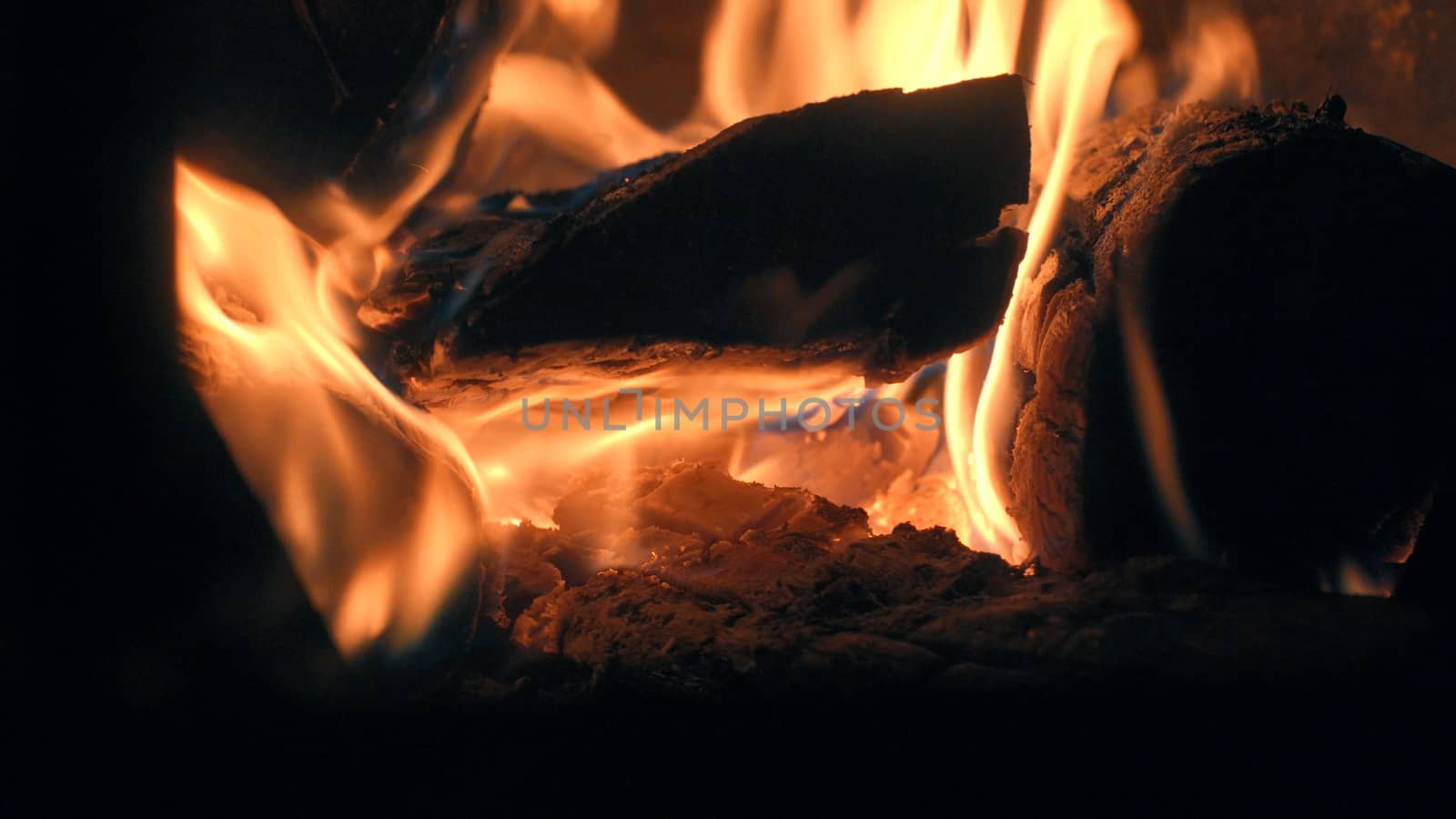 Wood burning in the stove. Fire close up.