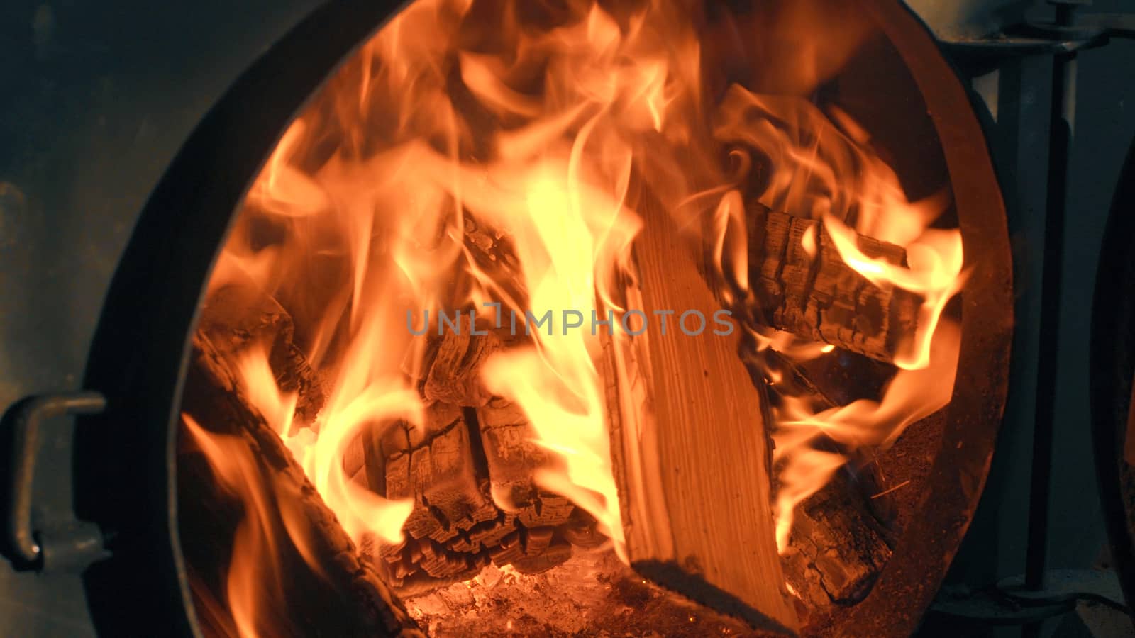 Wood burning in the stove. Fire close up.