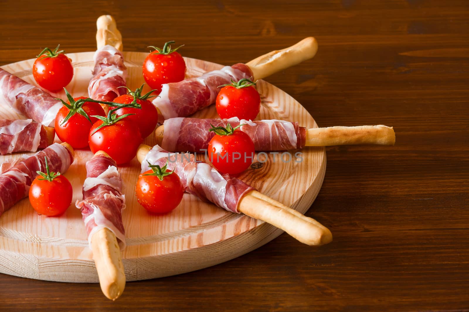 Italian chopping board with ham cheese and cherry tomatoes by LuigiMorbidelli