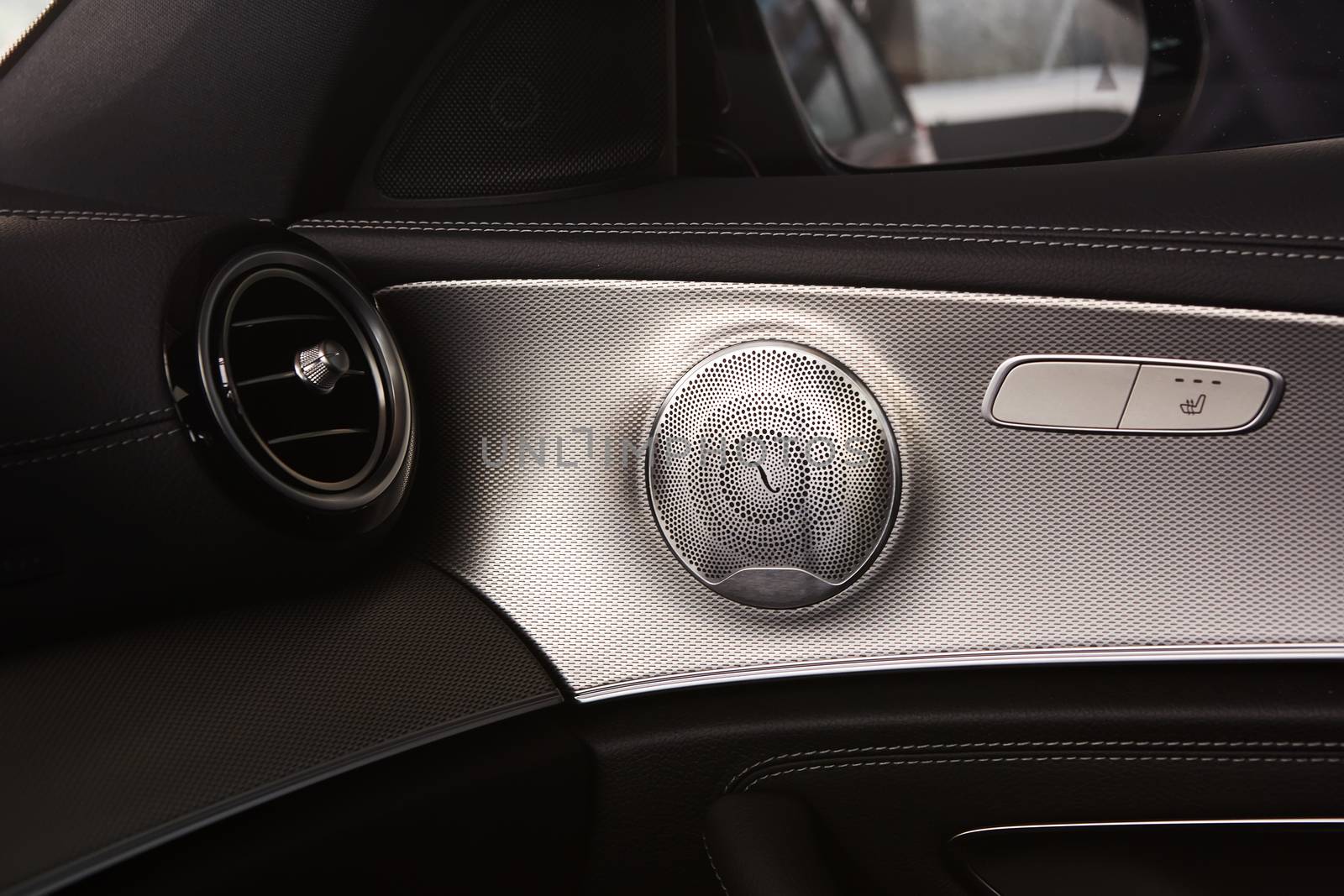 Elegant luxury car door interior. Shallow dof