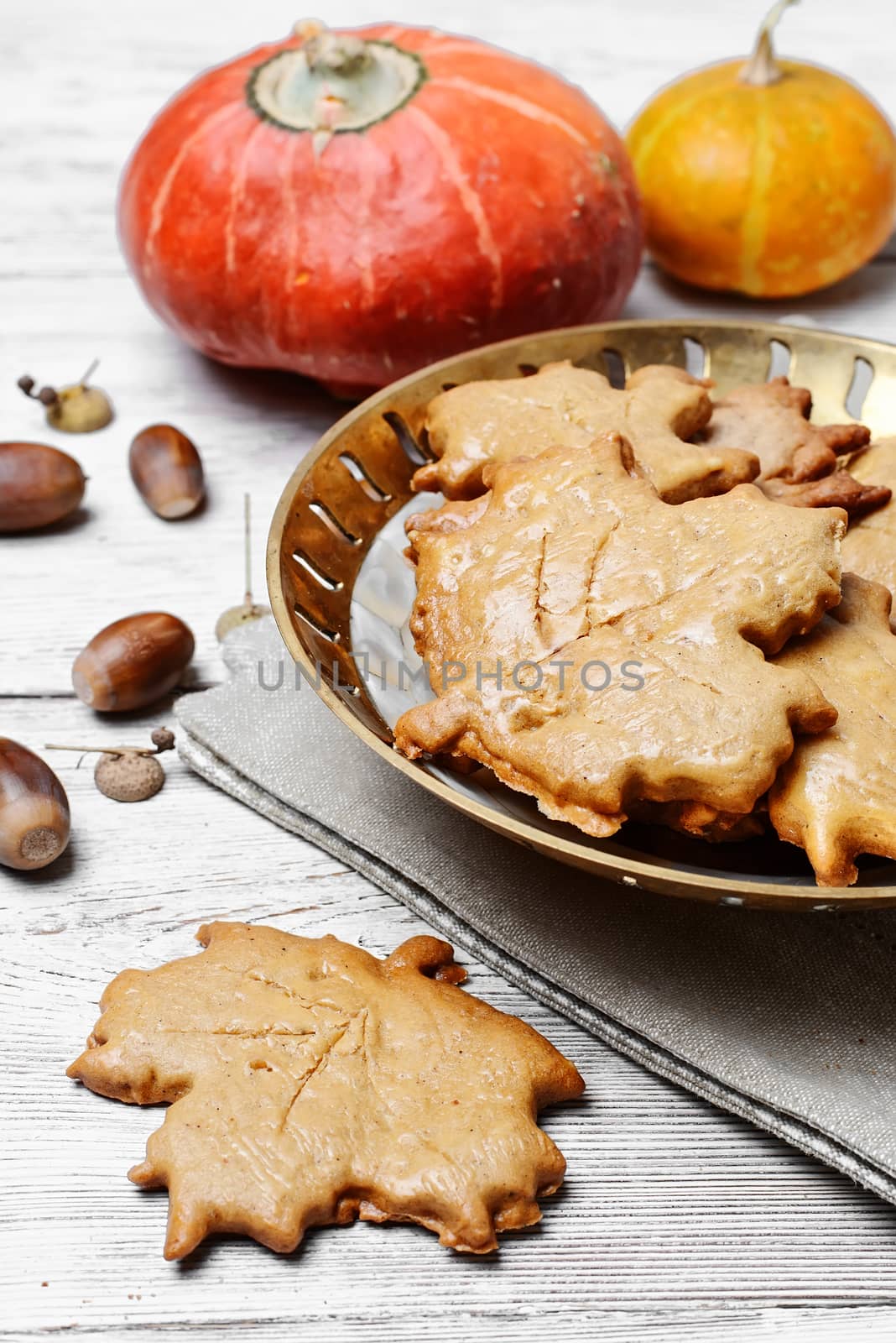 Cookies in the shape of maple autumn leaf in the autumn decoration