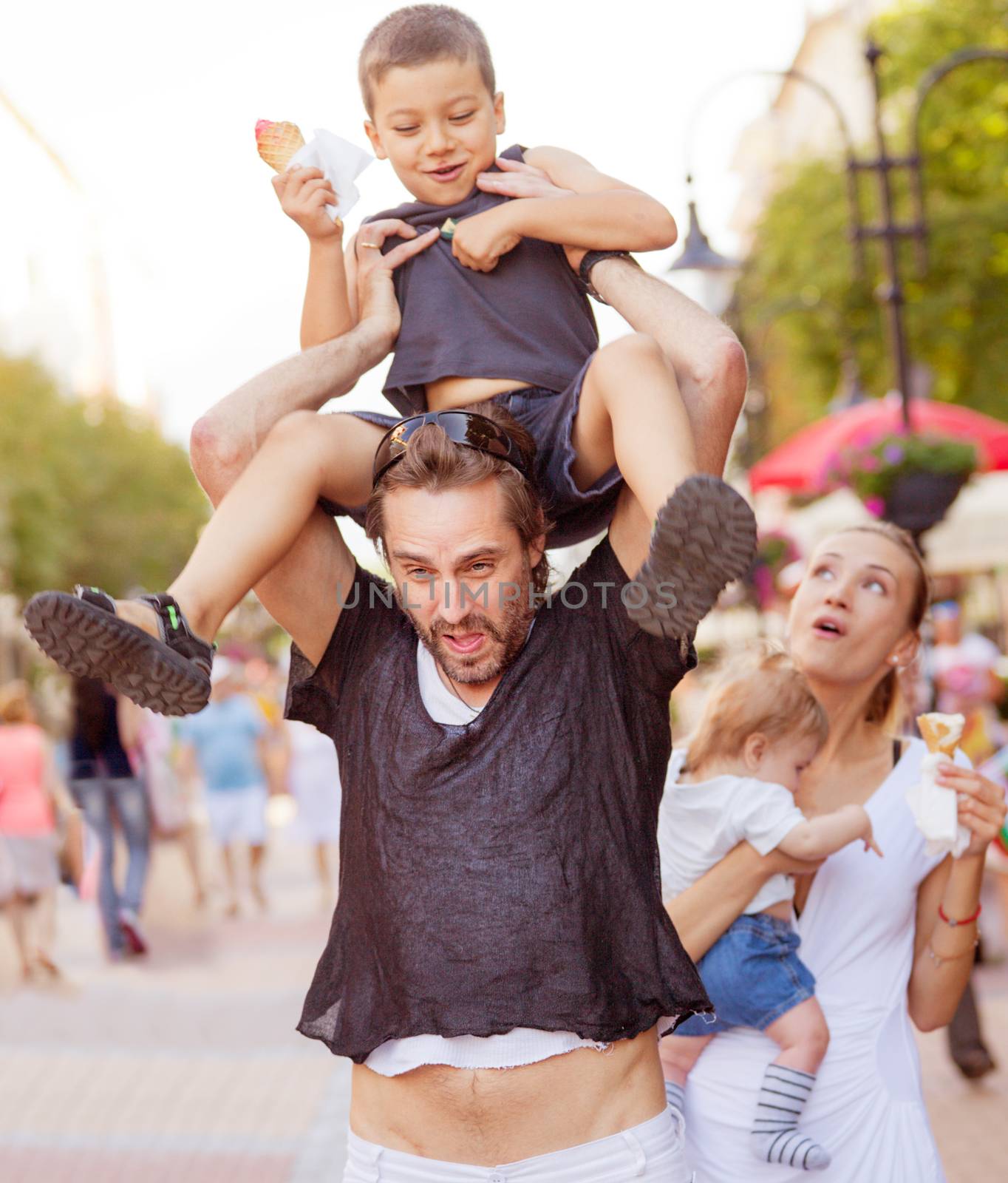 A young couple is struggling while trying to entertain their two boys.