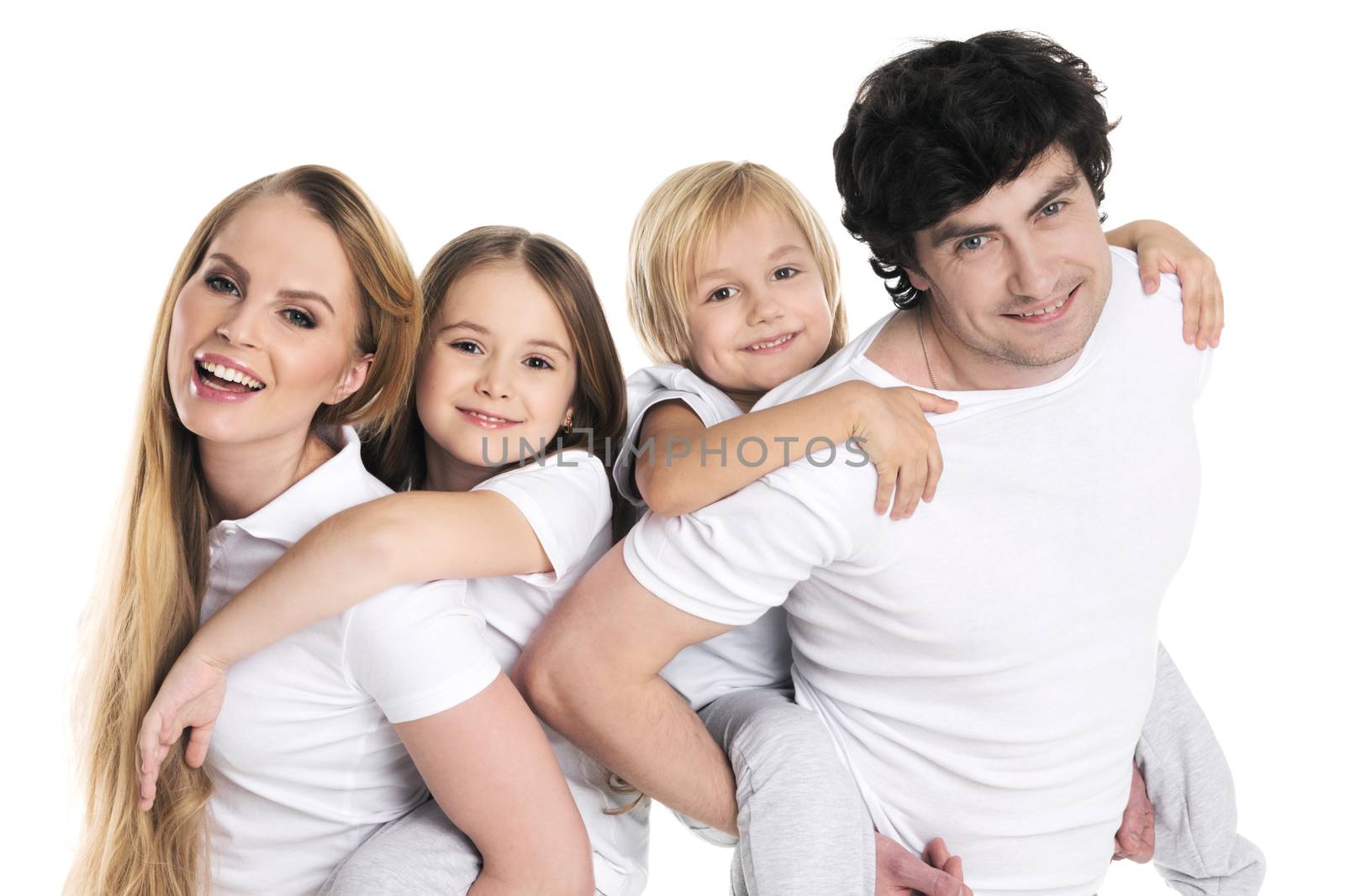 Parents giving two children piggyback rides smiling isolated on white background