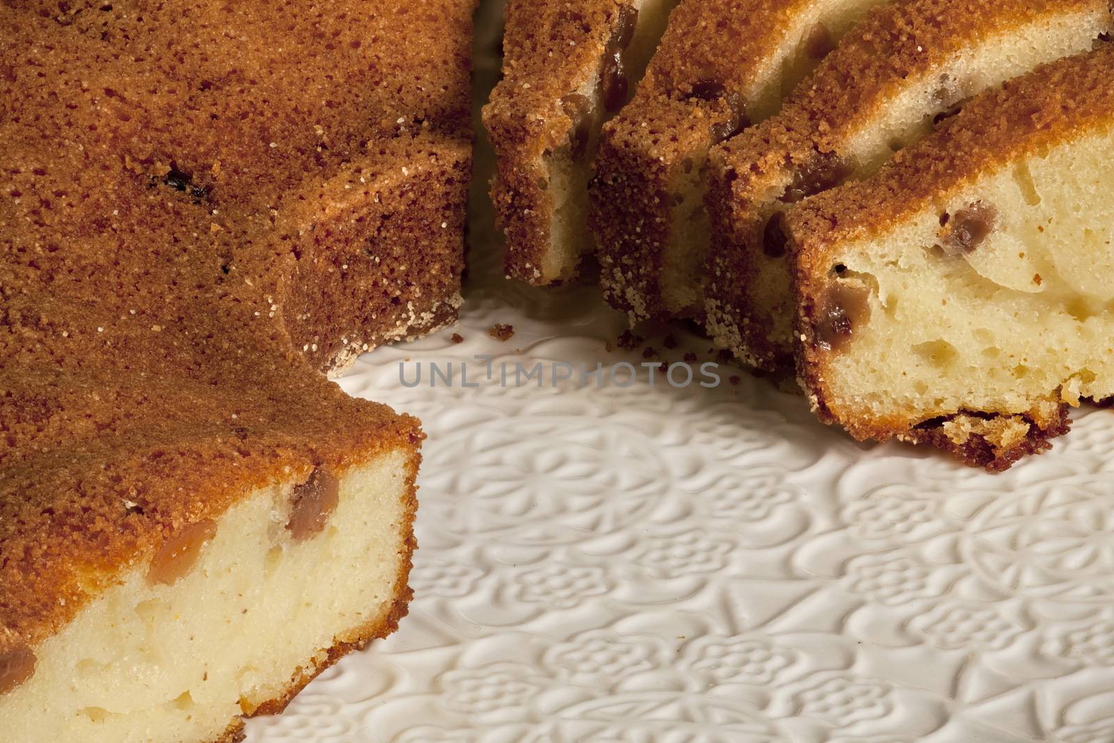 tasty cake muffins with raisins with a crust on a plate macro shot