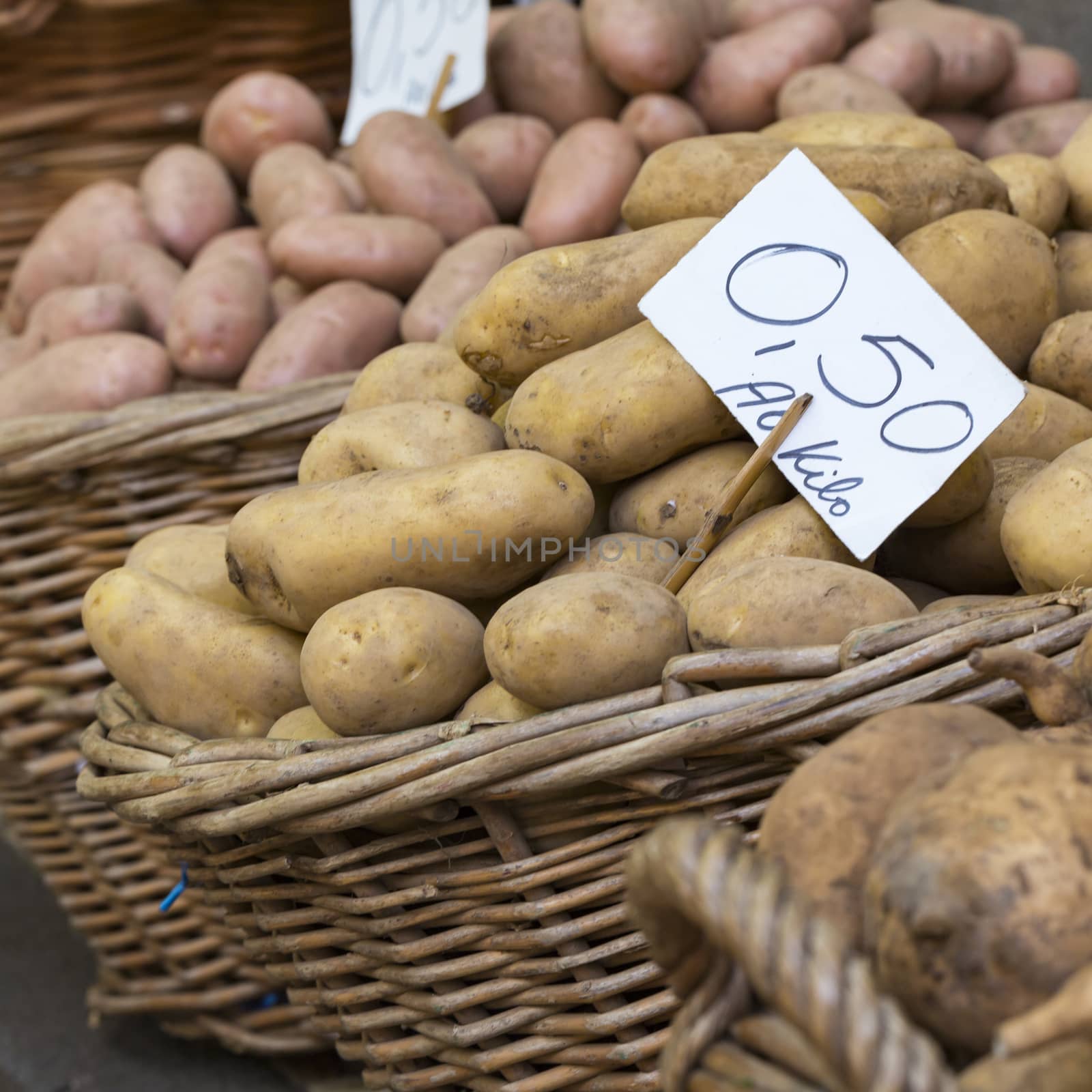 Group of Potatoes in local farmer market. by mariusz_prusaczyk