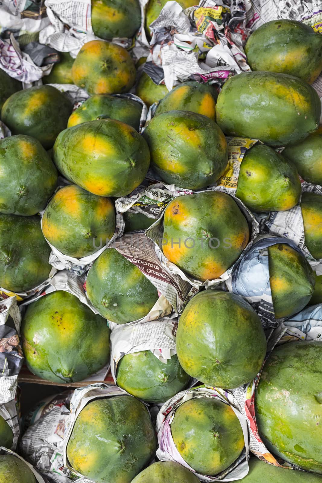 Fresh organic ripe papayas at a farmer's market in Kandy, Sri Lanka.
