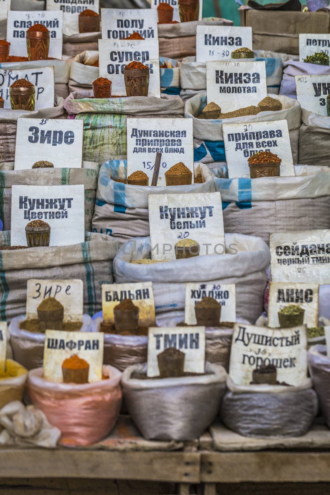 Vivid oriental central asian market with bags full of various spices in Osh bazar in Bishkek, Kyrgyzstan.