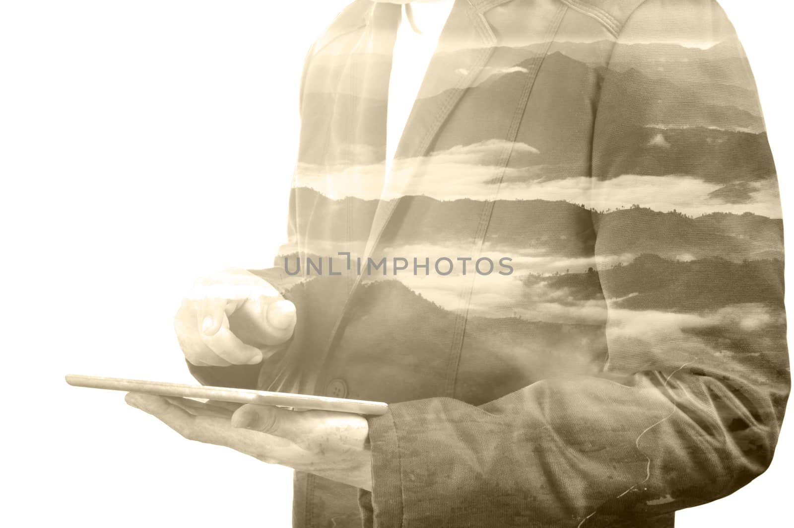 Businessman with Digital Wireless Tablet and Mountain Nature Background with Fog, Double Exposure as Environment Concept.