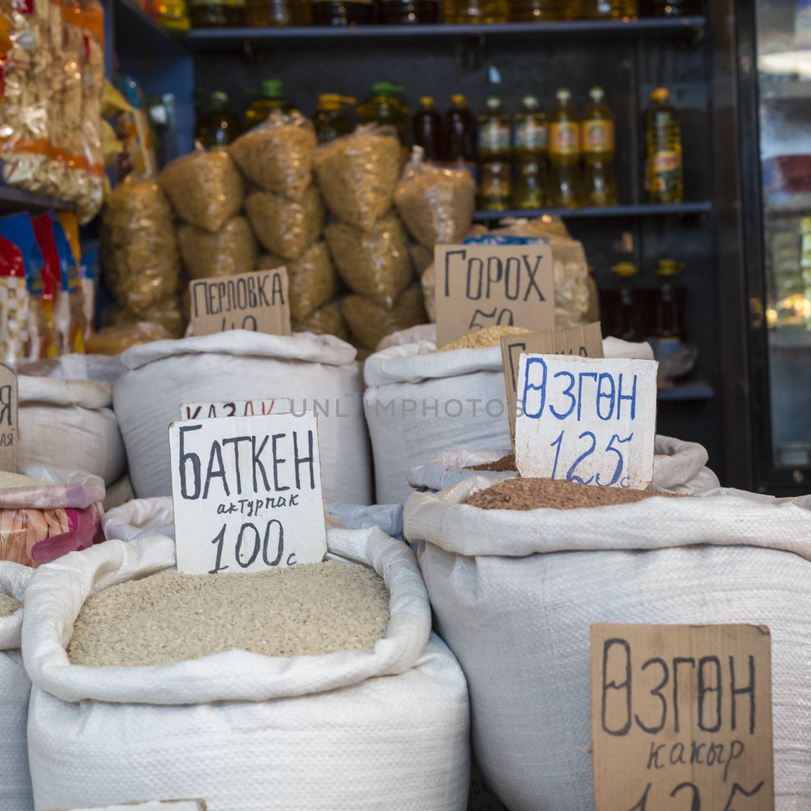 Spices and vegetables in bags at local bazaar in Osh. Kyrgyzstan by mariusz_prusaczyk