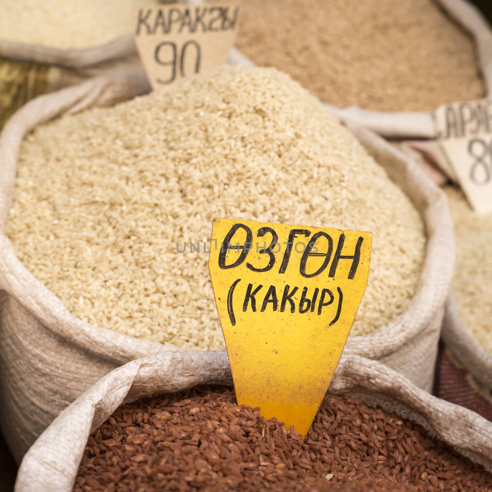 Spices and vegetables in bags at local bazaar in Osh. Kyrgyzstan by mariusz_prusaczyk