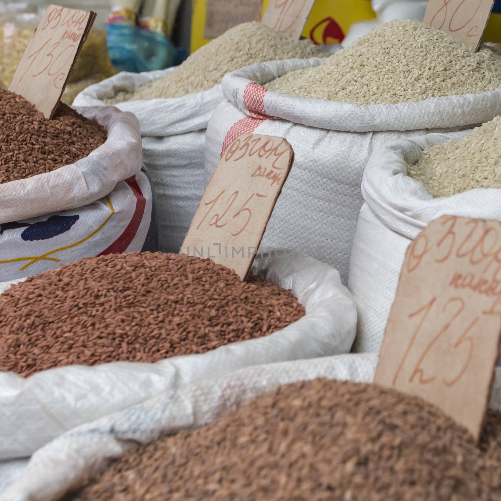 Spices and vegetables in bags at local bazaar in Osh. Kyrgyzstan.