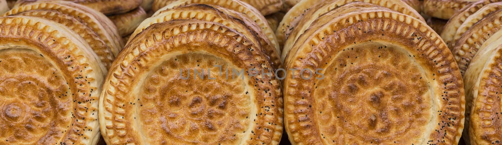 Kirghiz bread tokoch on Sunday market in Osh. Kyrgyzstan.